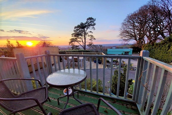 Panoramic view of Axe Valley from private balcony of small double room, Netherleigh B&B